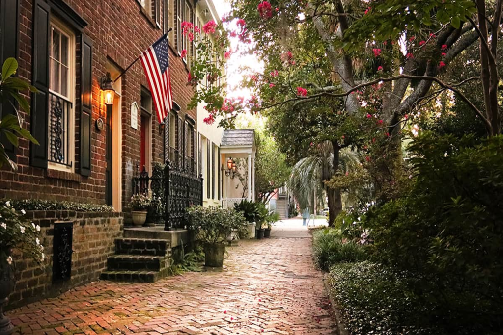 A charming street scene in the historic district, with blooming flowers and historic homes is the best place to visit in April