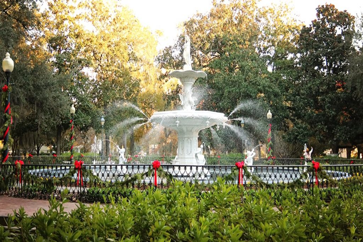 A serene image of Forsyth Park’s fountain surrounded by blooming azaleas is the best place to visit in April