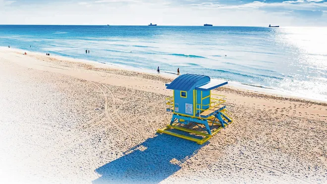  South Beach with its iconic lifeguard towers and crystal-clear waters.